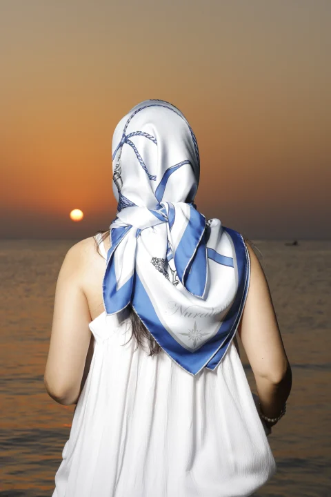 Azure Keepsake tied over the head, seen from behind at sunset