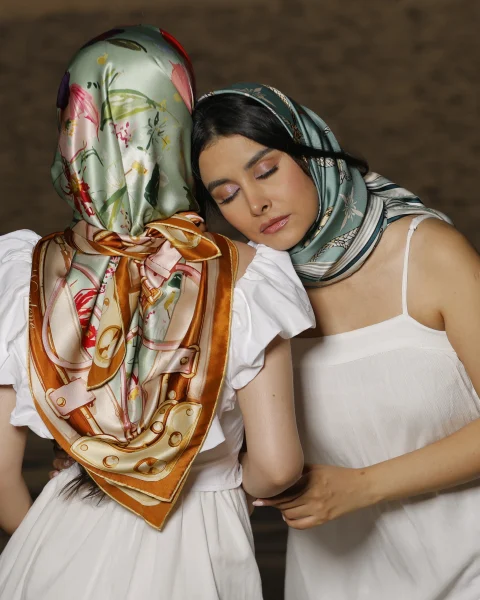 Meadow Poem on the left beside Mint Reverie, cropped to the scarves and upper bodies