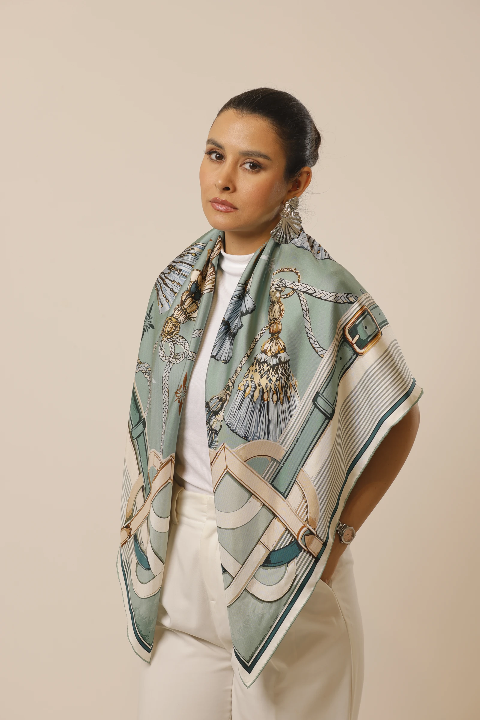 Mint Reverie silk scarf draped over the shoulders in the studio